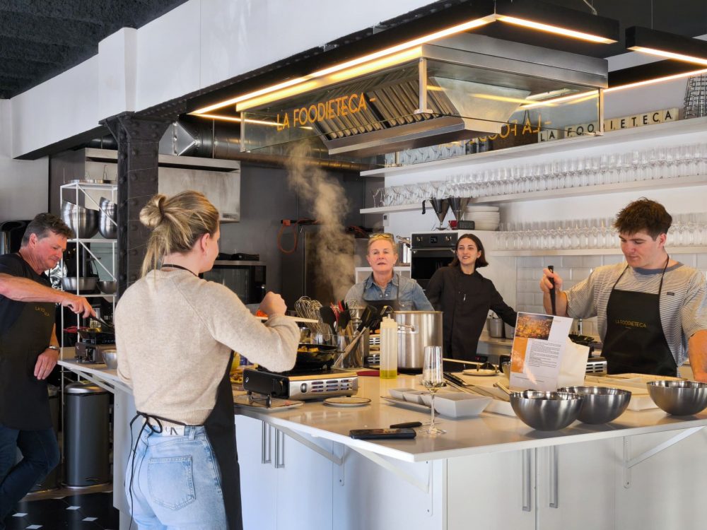Spanish paella cooking class with local ingredients