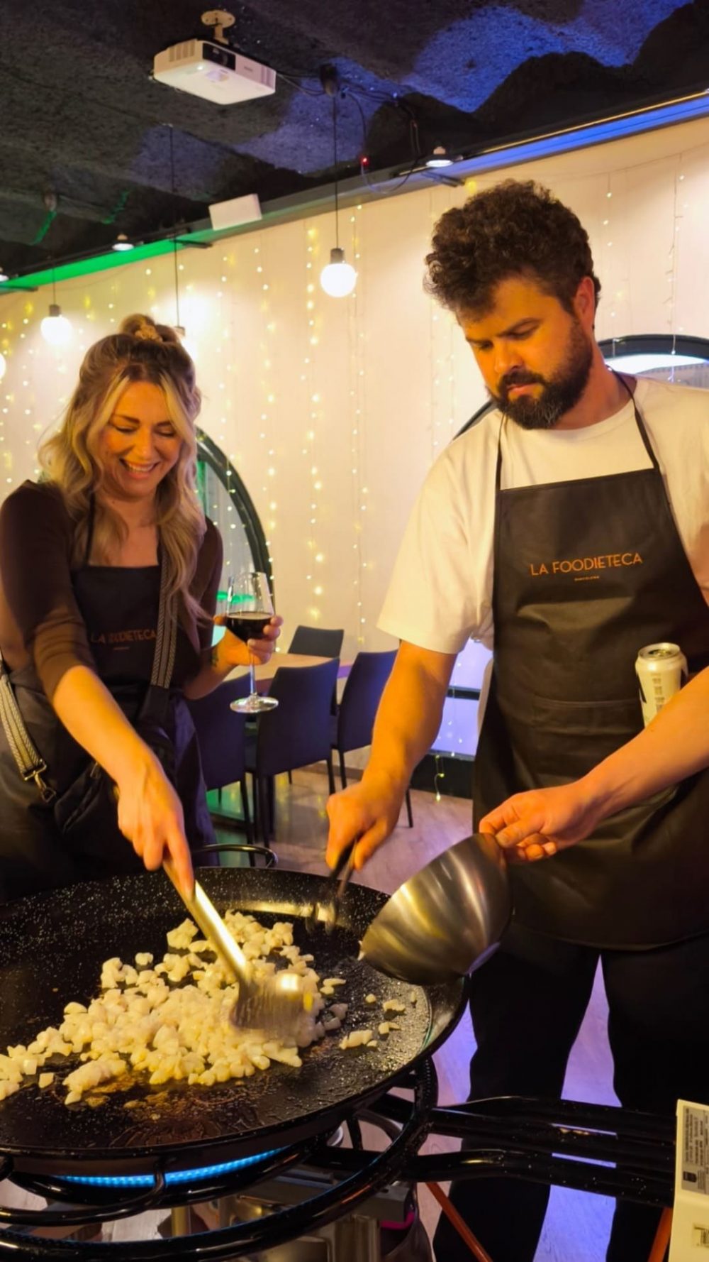 Guests cooking paella during a premium Spanish cooking class in Barcelona